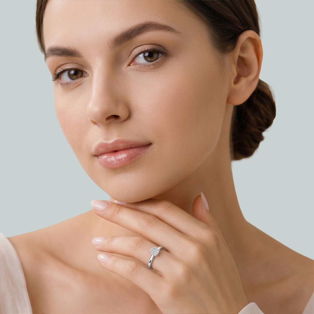 Cushion-Cut Diamond Engagement Ring with Cathedral High Setting in white gold, worn on the hand